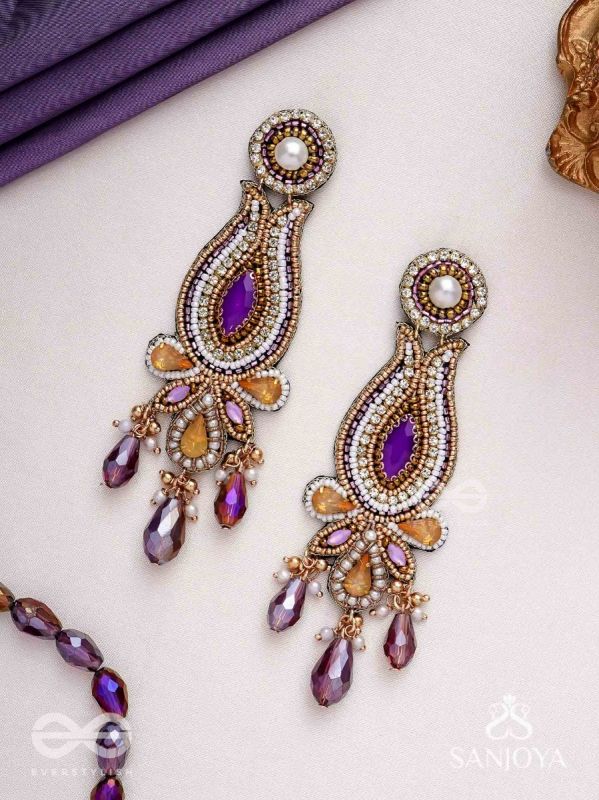 Divyaśhobhanā-Divine Splendour-Lotus-inspired embroidered design, adorned with purple and golden gem-studded motifs, Pearl and Beads.