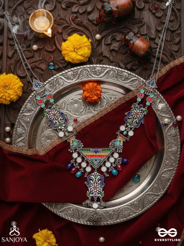 Prema raga- Love colour- Enamelled oxidized neckpiece embellished with beads, mirror and dangling jhumka.