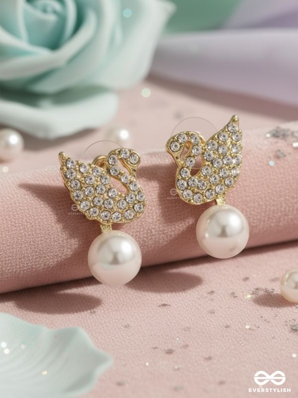 CELESTE SWAN – RADIANT WINGED STUDS WITH A CLASSIC PEARL DROP
