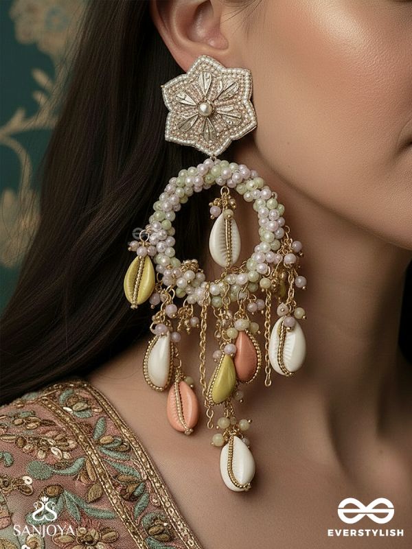 TARASAAGAR – CONSTELLATIONS MEET THE SEA – STAR-TOP EARRINGS WITH PEARL RIM AND PASTEL SHELL DROPS