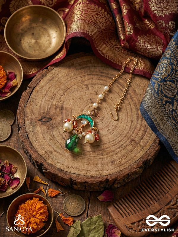 ISHVARIKA – CELESTIAL ORNAMENT – TURQUOISE ARC MAANGTIKA WITH ENAMEL DISC DETAIL AND GREEN TEARDROP FINISH