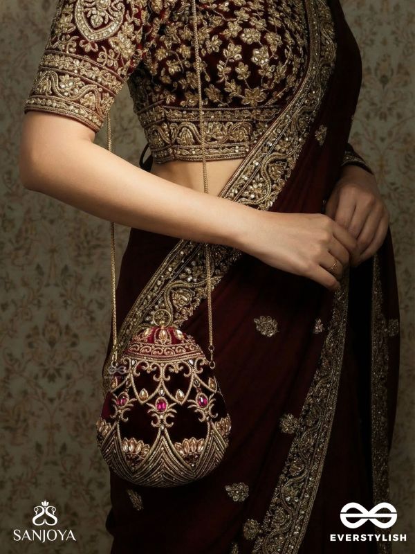 ZEENAT – OVAL DARK PINK VELVET CLUTCH WITH DETAILED EMBELLISHMENT AND GOLDEN METAL FRAME