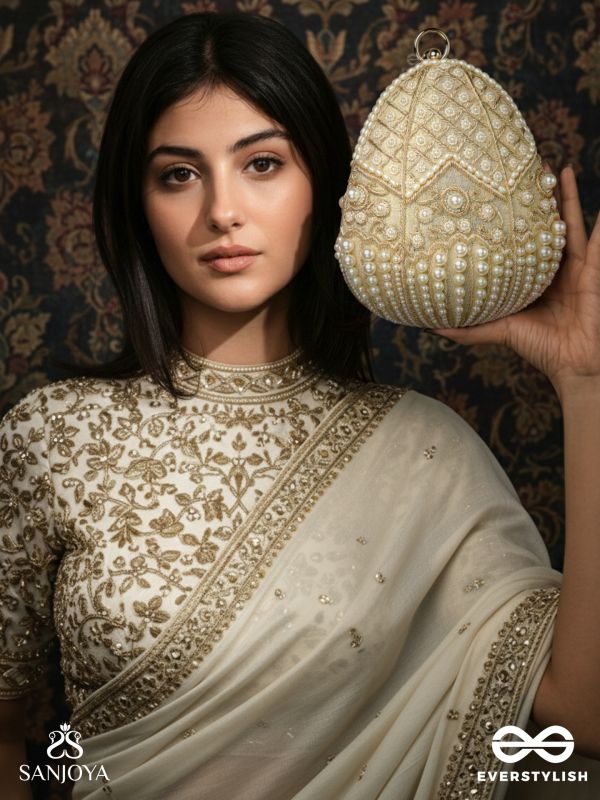 SAHIBA  – OVAL IVORY SILK CLUTCH WITH PEARL EMBEDDING AND GOLDEN METAL FRAME