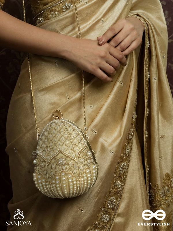 SAHIBA  – OVAL IVORY SILK CLUTCH WITH PEARL EMBEDDING AND GOLDEN METAL FRAME