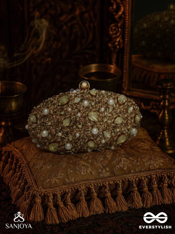 CHANDRAAYA – POLISHED OVAL GOLDEN BRONZE SILK CLUTCH WITH INTRICATE JEWEL STONE EMBELLISHMENT AND GOLDEN METAL FRAME