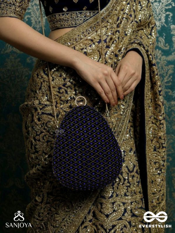 SITARAA – POLISHED OVAL ROYAL BLUE VELVET CLUTCH WITH STONE-ACCENTED HANDWORK AND GOLDEN METAL FRAME