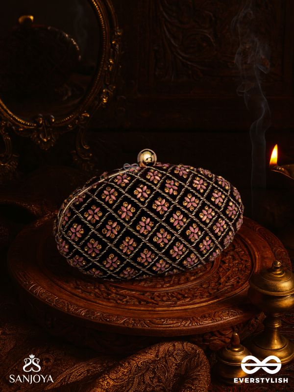 NAZRANA – CURVED MAROON SHADE TEXTILE CLUTCH WITH ORNAMENTED GRID EMBELLISHMENT AND GOLDEN METAL FRAME