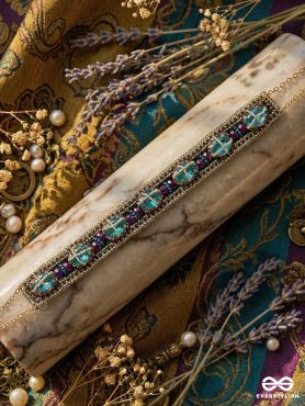 MANITARA – STAR OF JEWELS – PANELLED NECKLACE WITH TURQUOISE STONE SETTINGS AND ORNAMENTAL DARK ENAMEL FRAMEWORK