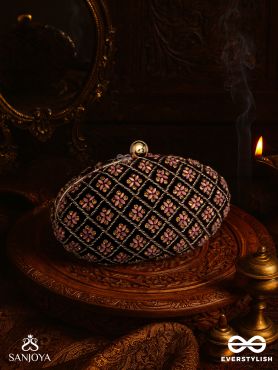 NAZRANA – CURVED MAROON SHADE TEXTILE CLUTCH WITH ORNAMENTED GRID EMBELLISHMENT AND GOLDEN METAL FRAME