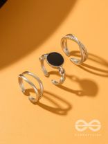  THREE-WAY- SET OF THREE BLACK AND SILVER RINGS