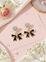 BOW TO THE NIGHT - GOLDEN AND BLACK EMBELLISHED EARRINGS