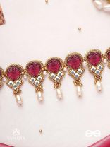 PREMABHUSHANAM - ADORNMENT OF LOVE - RED ENAMEL ON STONES, PEARLS AND KUNDAN DETAILING CHOKER NECKLACE