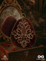 NOOR – OVAL MAROON VELVET CLUTCH WITH RICH ZARDOZI EMBROIDERY AND GOLDEN METAL FRAME