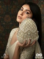 SAHIBA  – OVAL IVORY SILK CLUTCH WITH PEARL EMBEDDING AND GOLDEN METAL FRAME