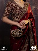 ZEVARIYA – HEIRLOOM-STYLE OVAL CLUTCH WITH INTRICATE ZARI DETAILING AND GOLDEN METAL FRAME