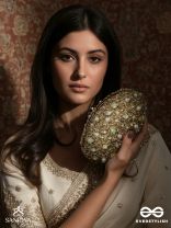 CHANDRAAYA – POLISHED OVAL GOLDEN BRONZE SILK CLUTCH WITH INTRICATE JEWEL STONE EMBELLISHMENT AND GOLDEN METAL FRAME
