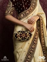 ROHINI – POLISHED BRONZE BROWN TEXTILE CLUTCH WITH FACETED JEWEL ACCENTS AND GOLDEN METAL FRAME