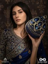 SITARAA – POLISHED OVAL ROYAL BLUE VELVET CLUTCH WITH STONE-ACCENTED HANDWORK AND GOLDEN METAL FRAME