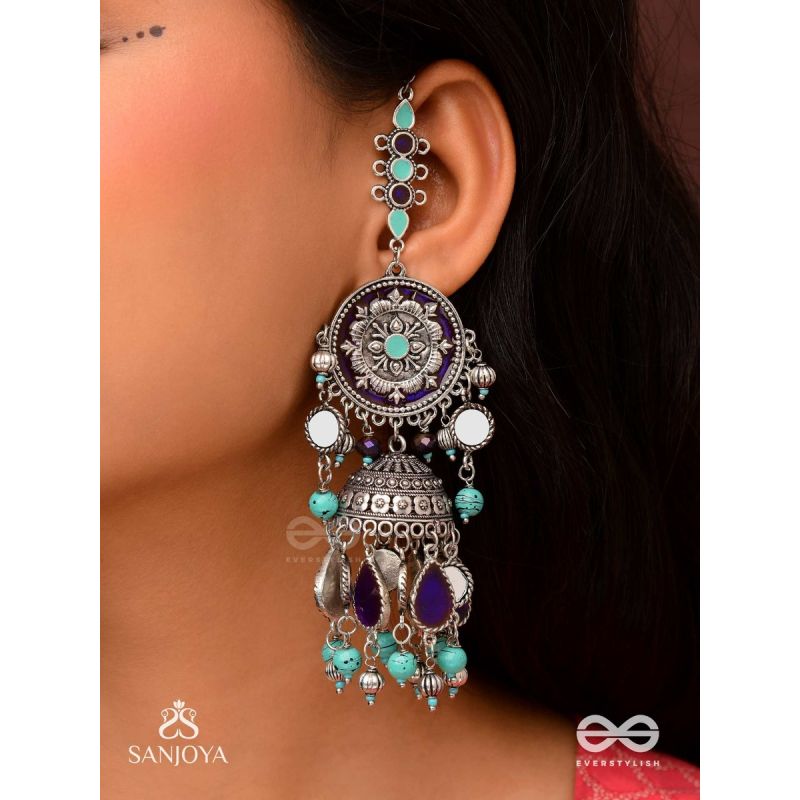 RATNA TILAKA-JEWEL ADORNMENT- EARRINGS ENAMELLED IN SHADES OF BLUE AND BLACK, ACCENTED WITH GHUNGROO BEADS AND OXIDIZED JHUMKI