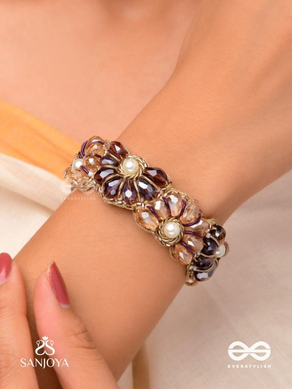 SHYAMALIKA – DARK BLOOM A FLORAL-INSPIRED BRACELET ADORNED WITH DARK-HUED GEMSTONES AND PEARLS