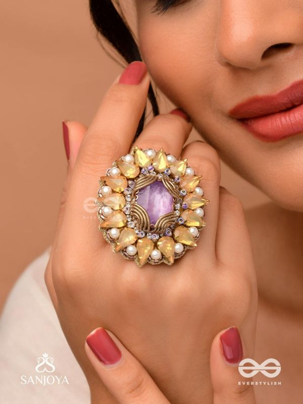 KANAKA PUSHPA – GOLDEN FLOWER EMBROIDERED FLOWER-SHAPED RING ADORNED WITH YELLOW GEMS AND PEARLS, GIVING A GOLDEN GLOW