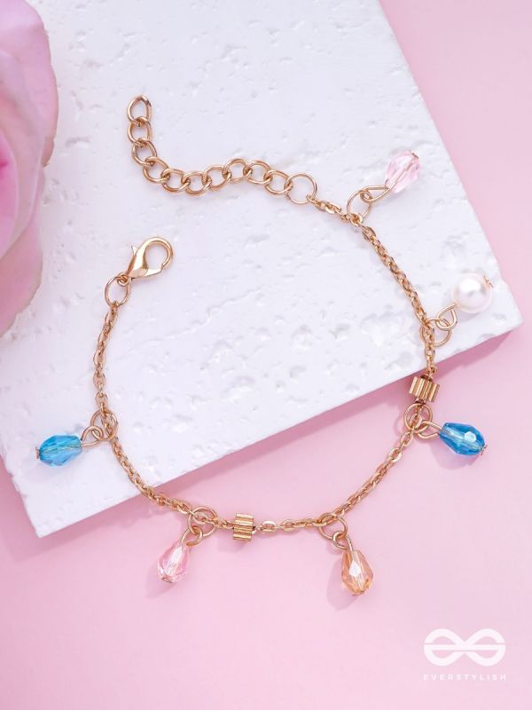 The Shimmering Sleet- Pearl and Crystals Studded Golden Bracelet