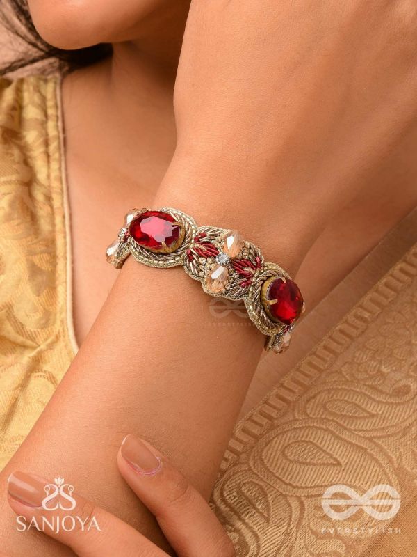 Sundarasūra- Beautiful Wine- Bracelet with rich hue of the red stones and twisted thread work.