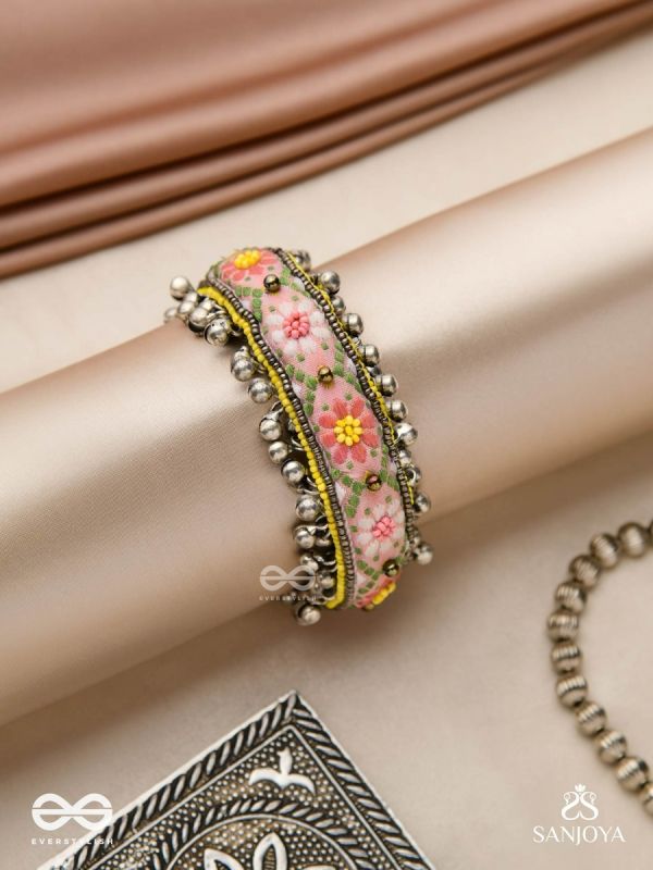 SUMANALEKHA-FLORAL PATTERN- SEMI-OXIDIZED BRACELET FEATURES GHUNGROO, BEADS, AND EMBROIDERED FLOWERS