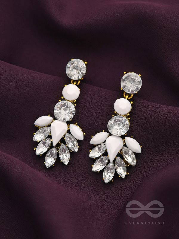The pious touch white enigmatic stones studded earrings 