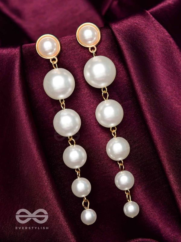 Elegance is a deadly weapon- white pearls statement earrings