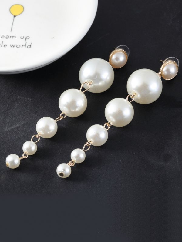 Elegance is a deadly weapon- white pearls statement earrings